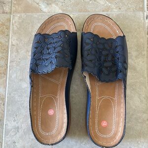 Blue slides with a cute floral cutout size 42. Like new